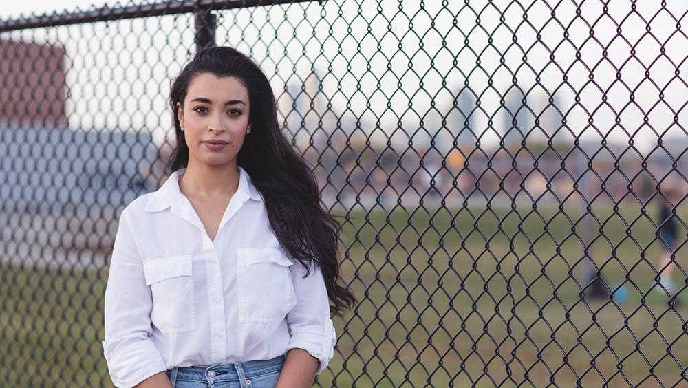 Nessrine Lara Lemqadem Alyass posing outside of school