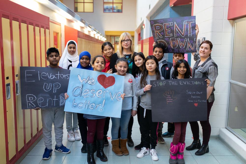 teacher with students in hall