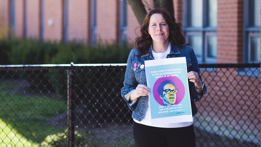 Woman holding sign