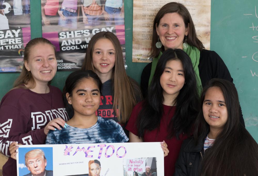 teacher and students holding up #metoo project