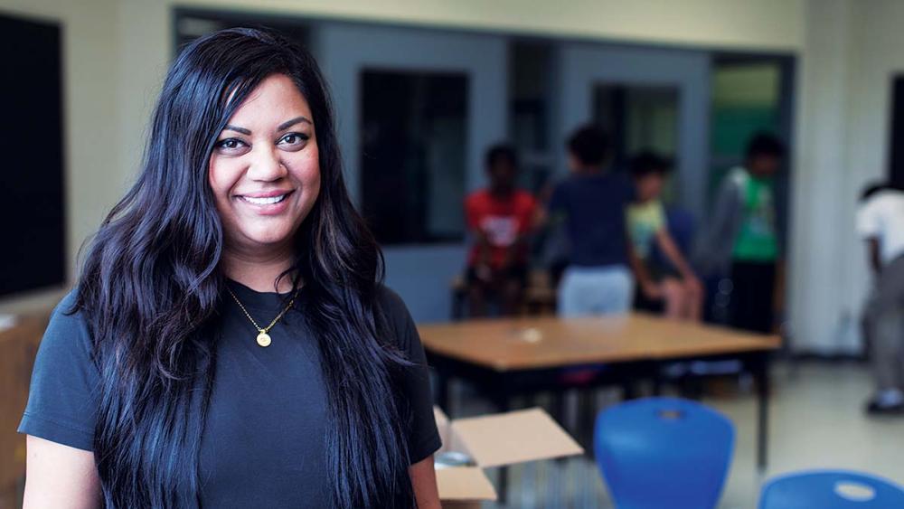 Neema Patel posing in classroom