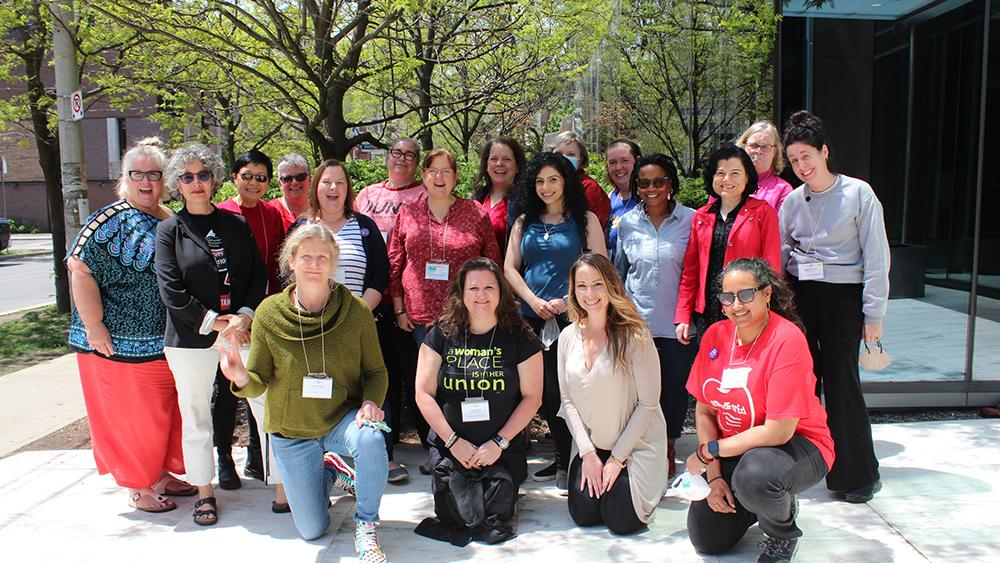 Women in Action group posing together in 2022