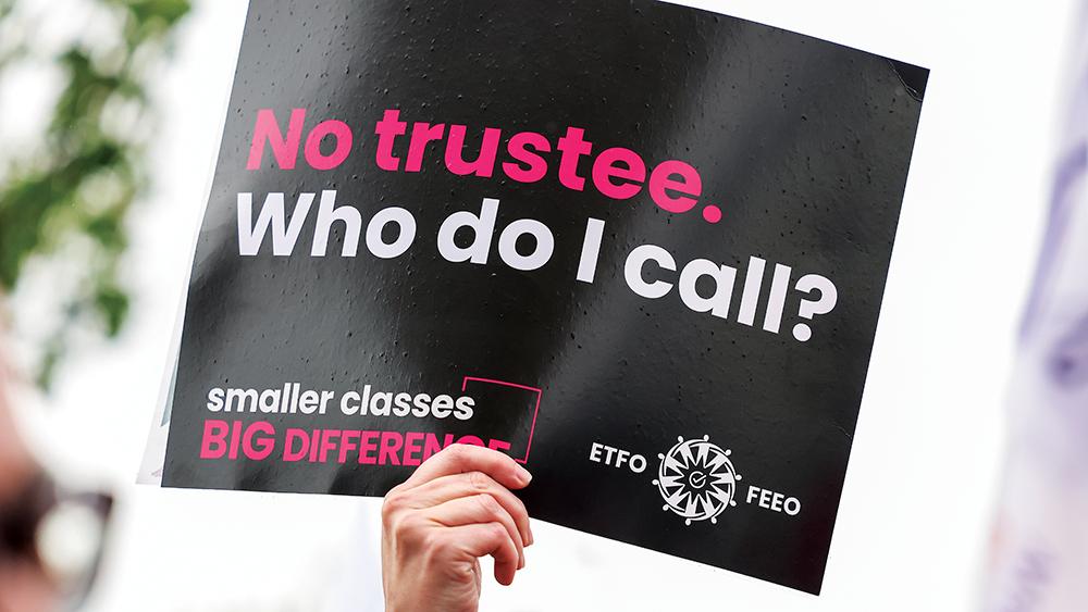 ETFO Members holding a sign at Day of Action
