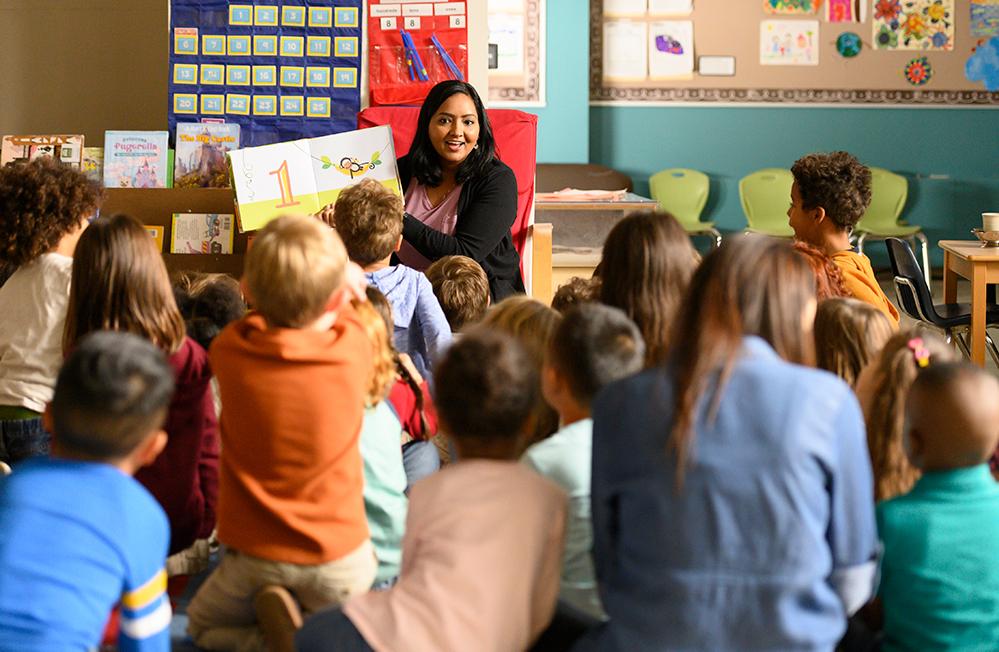 Teacher reading book to class