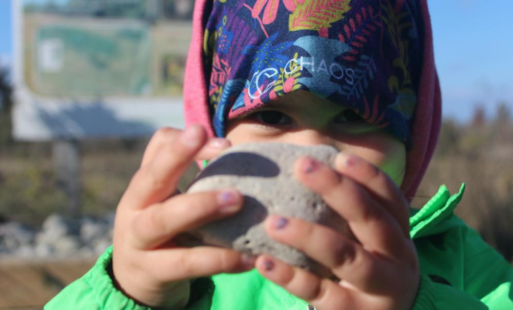 Child holding rock. Photo courtesy Tanya Leary