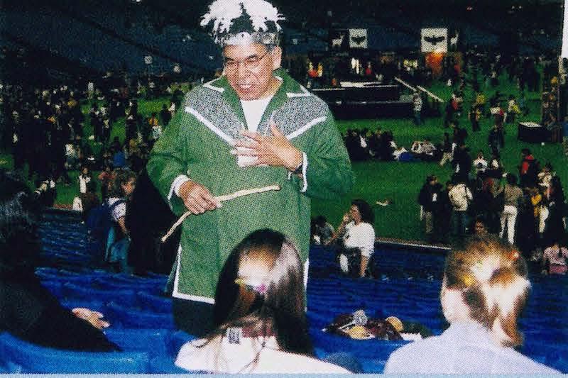 An elder talks with students in the stands at last year's Canadian Aboriginal festival