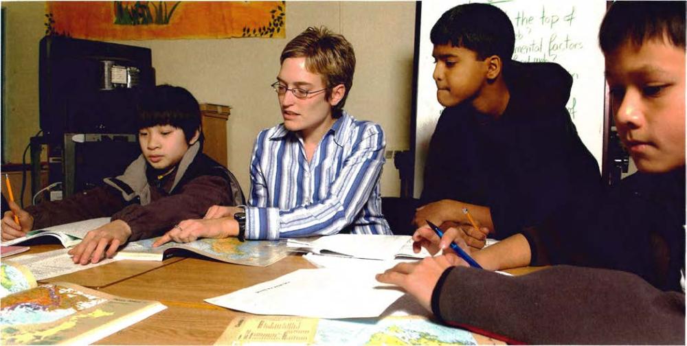 Teacher in school teaching class