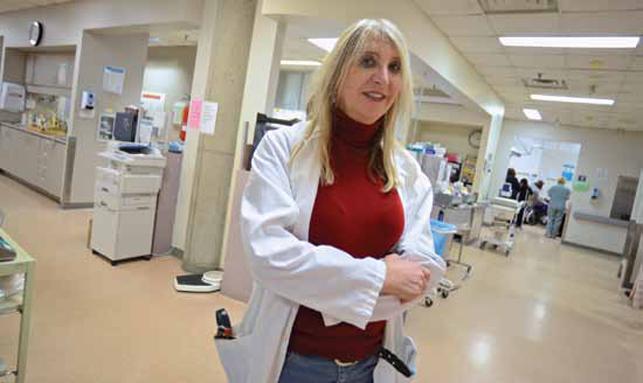 female nurse or doctor standing in hospital