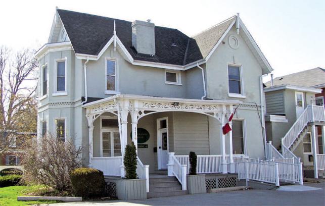 two story house with white siding