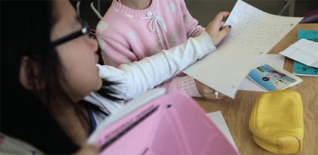 closeup of student holding paper