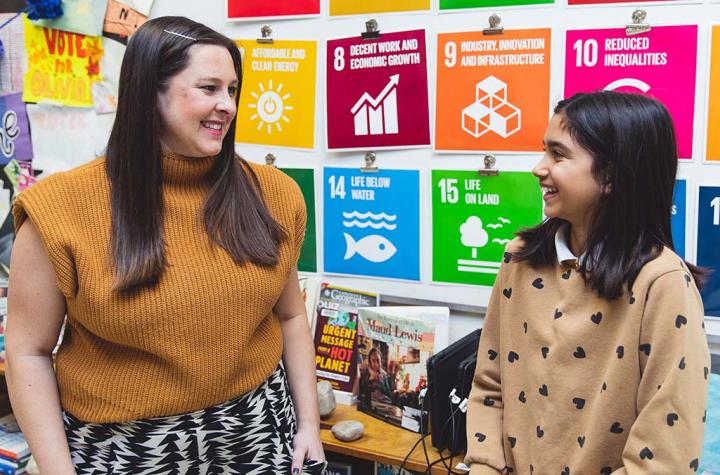 Sarah Lowes and Gweneth Arumainayaga talking in a classroom