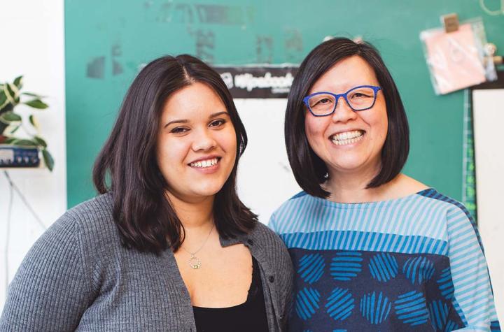 Climate Justice Activist Cecilia La Rose-Luciuk posing with Emily Chan in a classroom