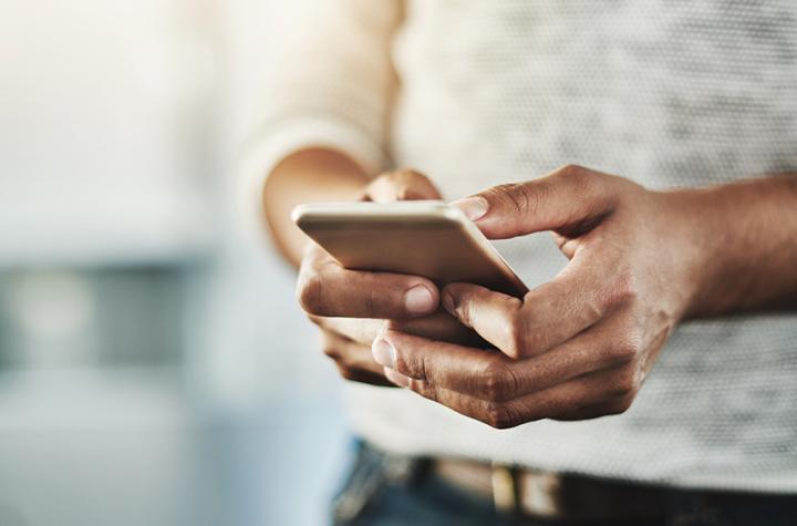 Stock image of person using a cellphone