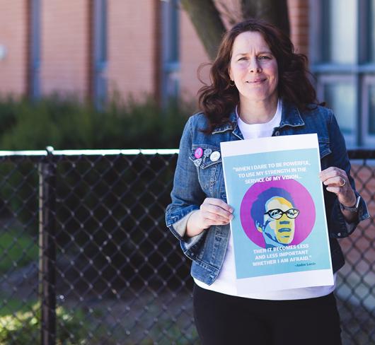 Woman holding sign