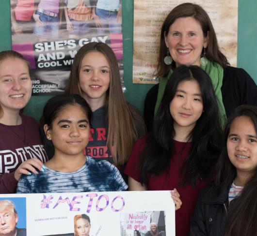 teacher and students holding up #metoo project