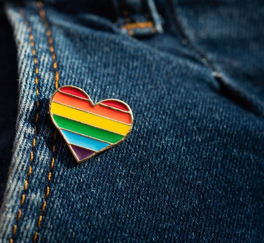 Pride pin on pair of jeans