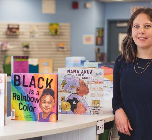 Amanda Cannon posing with children's books