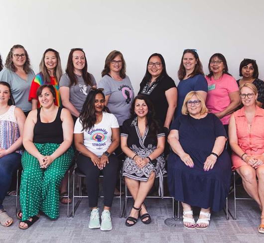 Mentor coaching members posing in the office