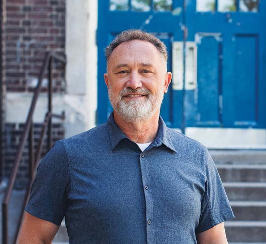 ETFO President David Mastin posing in front of school