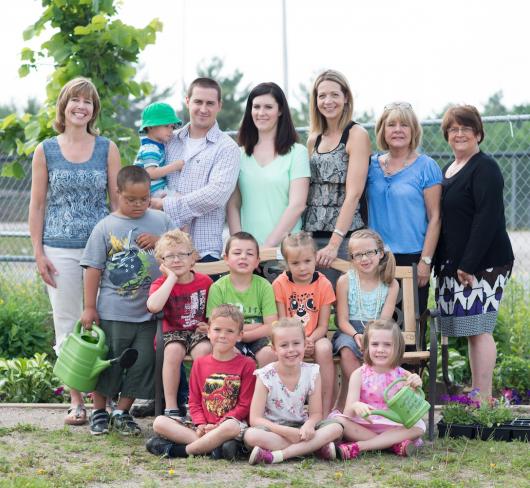 Classroom posing in butterfly garden