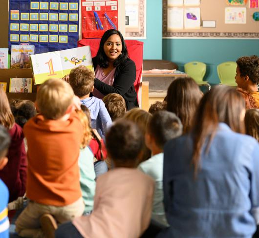 Teacher reading book to class