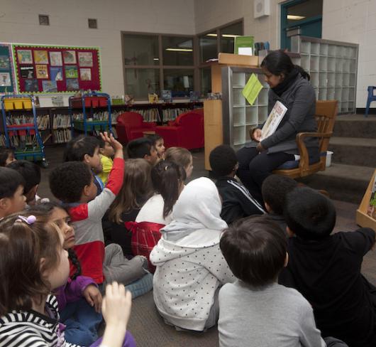 Teacher reading to class. Photo by Kathryn Gaitens