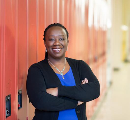 Natasha Henry standing in front of lockers