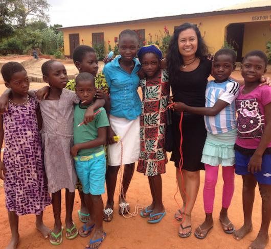 Teacher standing with Ghana students