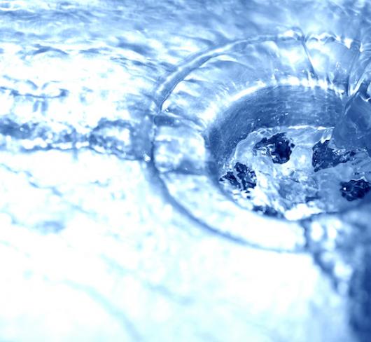 water in sink running down drain