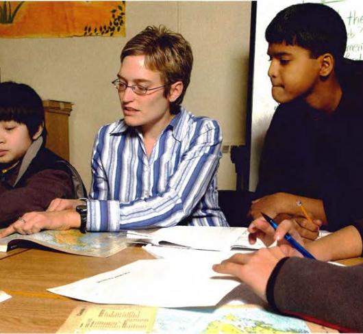 Teacher in school teaching class