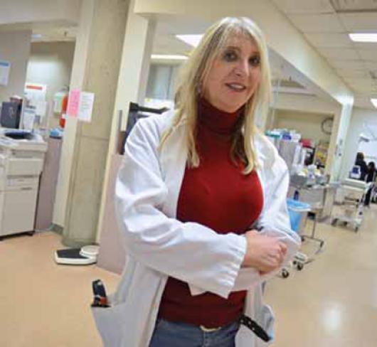 female nurse or doctor standing in hospital