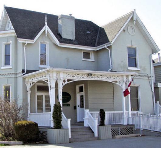 two story house with white siding