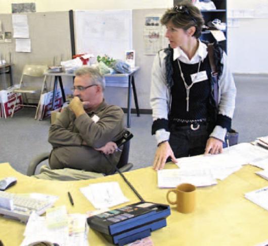 etfo staff or volunteers sorting papers in office