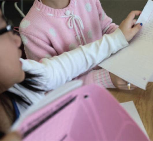closeup of student holding paper