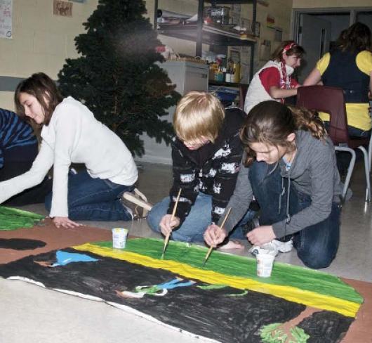 young students painting