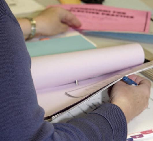 closeup of teacher flipping through book