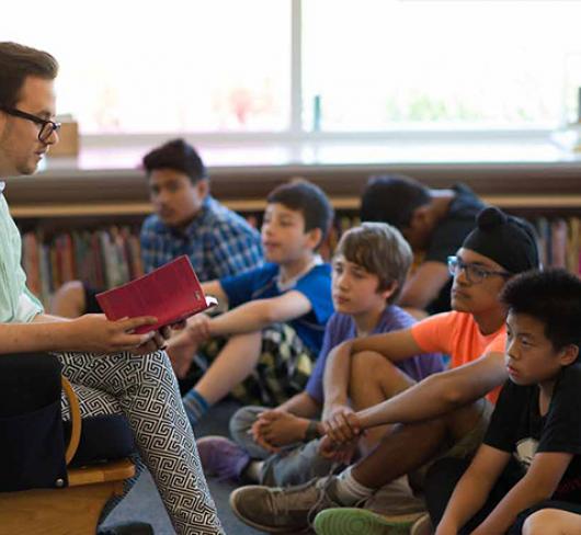 Author reading to students