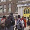 Children lining up to go into elementary school