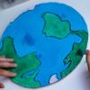 Child drawing the earth