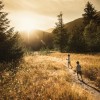 Children running outside in forest